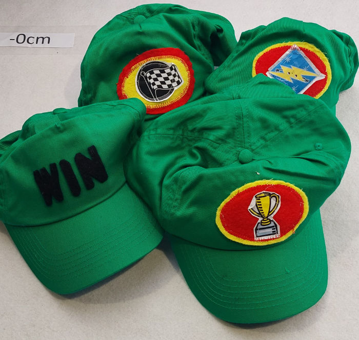 GREEN CAPS WITH LOGOS